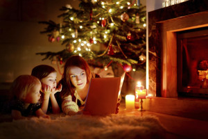 Mother and her daughters reading a book